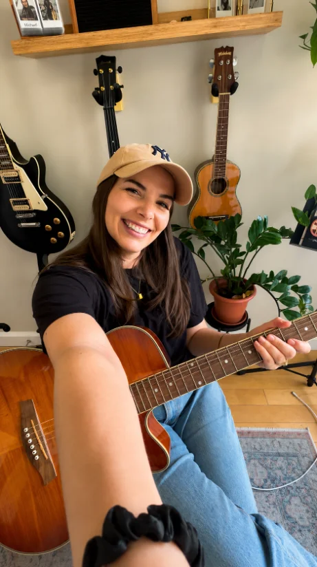 Katie Gettys (Mrs. G) with her guitar
